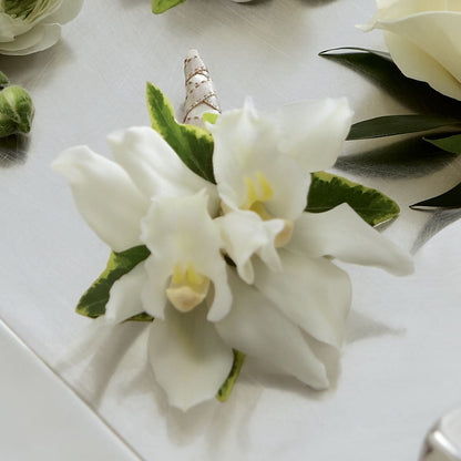 White Mini Cymbidium Boutonniere –  Floristeria Fabiana, Charlotte NC